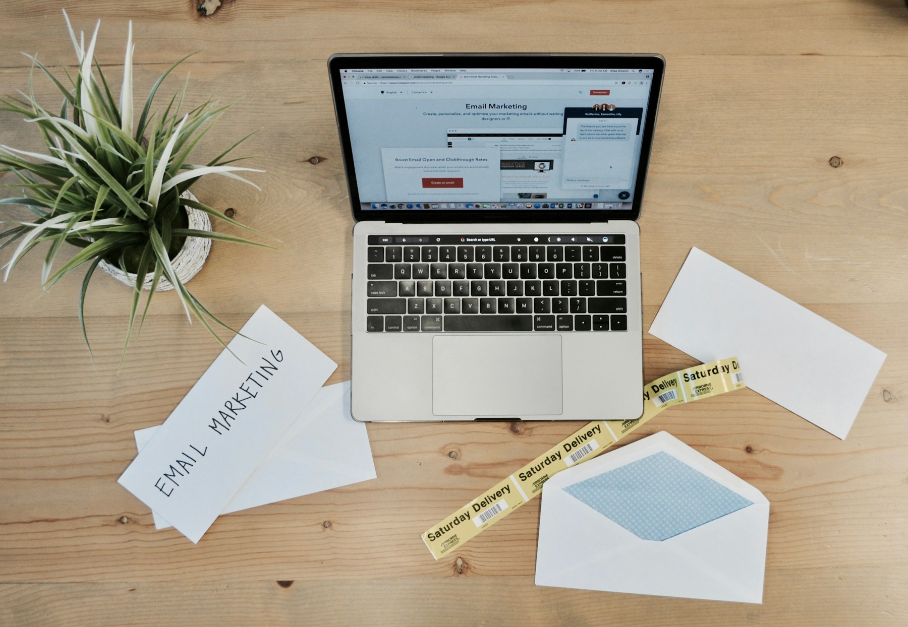 Email marketing workspace with campaign tools open on a laptop